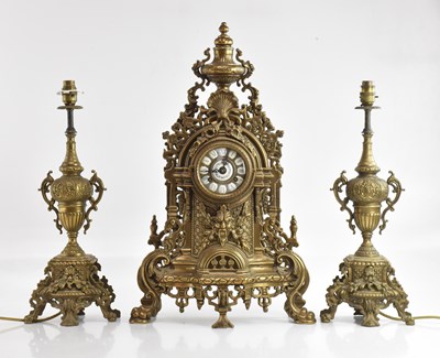 Lot 1376 - A reproduction French brass mantel clock, with...