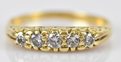 Lot 436 - An 18ct yellow gold diamond set five stone...
