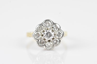 Lot 403 - An 18ct yellow and white gold diamond daisy...