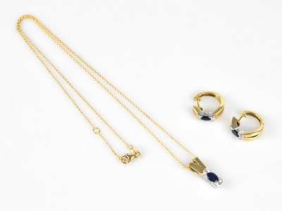 Lot 265 - A 14ct yellow gold diamond and sapphire...