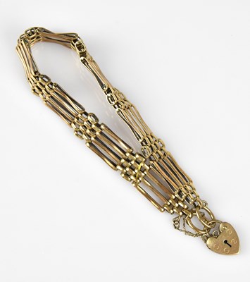Lot 69 - A 9ct yellow gold gate link bracelet with...
