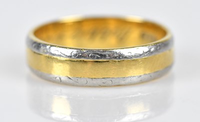 Lot 438 - An 18ct yellow and white gold wedding band,...