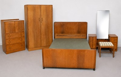 Lot 1026 - A mid 20th century oak five-piece bedroom...