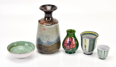 Lot 1600 - MOORCROFT; a squat baluster shaped vase in the...