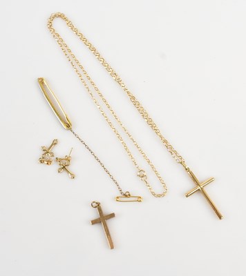 Lot 9 - A 9ct yellow gold crucifix pendant suspended...