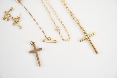 Lot 9 - A 9ct yellow gold cross pendant suspended on a...