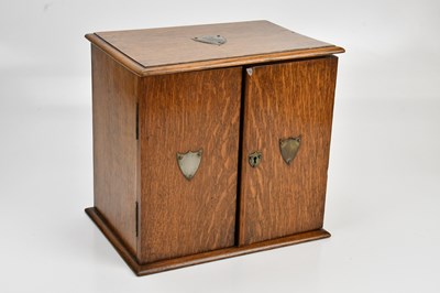 Lot 2059 - An early 20th century oak smoker's cabinet...