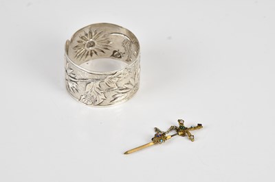 Lot 711 - A Continental white metal bangle, with a sword...