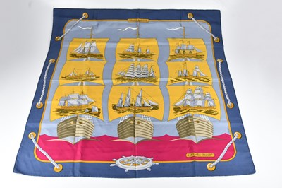 Lot 1254 - HERMÈS; a 100% silk twill blue, pink and gold...