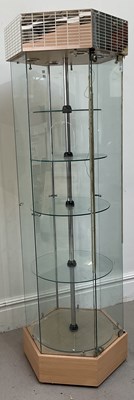Lot 1036 - A modern hexagonal revolving display cabinet,...
