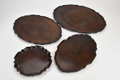 Lot 2035 - A set of three graduated mahogany trays,...