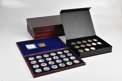 Lot 596 - A collection of commemorative boxed coins...