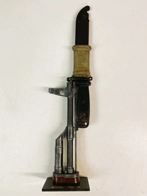 Lot 109 - An AK 47 bayonet, mounted on a plastic replica...