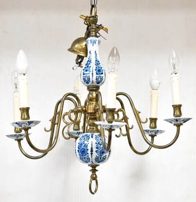 Lot 70 - A Delft-style brass and blue and white...