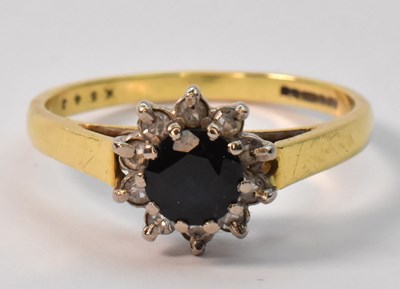 Lot 864 - An 18ct yellow gold dress ring with central...