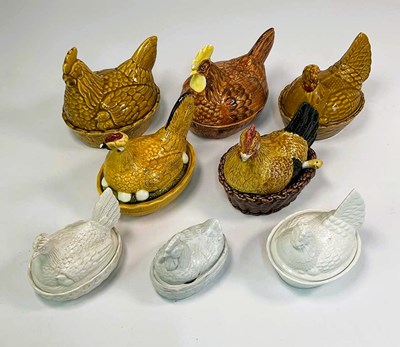 Lot 155 - Eight ceramic hen on nest egg holders.