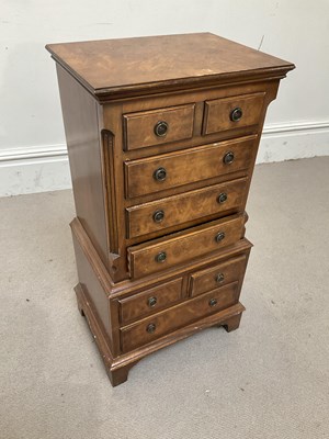 Lot 1033 - A reproduction walnut diminutive chest on...