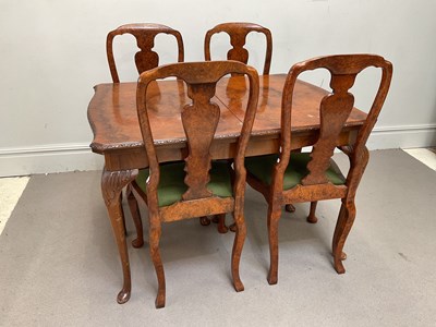 Lot 1106 - A Queen Anne style walnut extending dining...