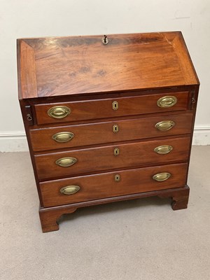Lot 1215 - A George III mahogany bureau, with fall above...