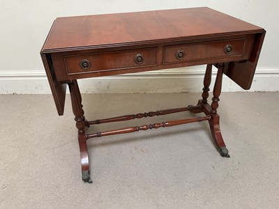 Lot 1137 - A reproduction mahogany sofa table, height...