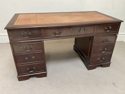 Lot 1107 - A reproduction mahogany pedestal desk, with...