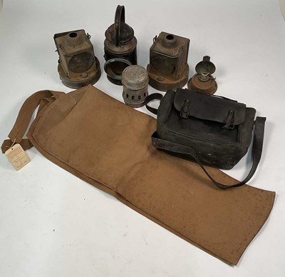 Lot 47 - A quantity of railway lamps, with a leather...