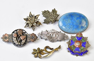 Lot 918 - A Ruskin ceramic cabochon brooch in a white...