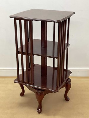 Lot 691 - A reproduction mahogany revolving bookcase,...