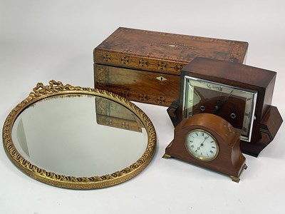 Lot 295 - An Art Deco oak veneered mantel clock, an...