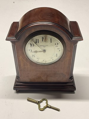 Lot 297 - BARRAUD & LUNDS; a mahogany inlaid mantel...