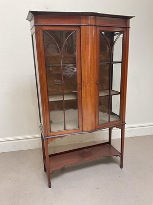 Lot 1242 - An Edwardian inlaid mahogany display cabinet...