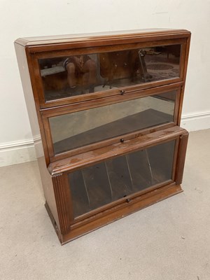 Lot 1279 - A mid 20th century walnut bookcase with up and...