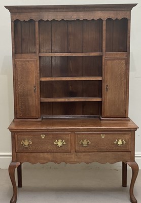 Lot 1088 - An oak dresser with boarded rack above two...
