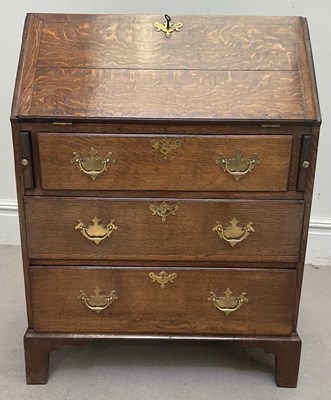 Lot 1070 - A Georgian oak bureau of small size, with...