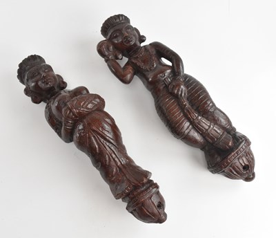 Lot 2033 - A pair of Eastern carved wooden figures,...