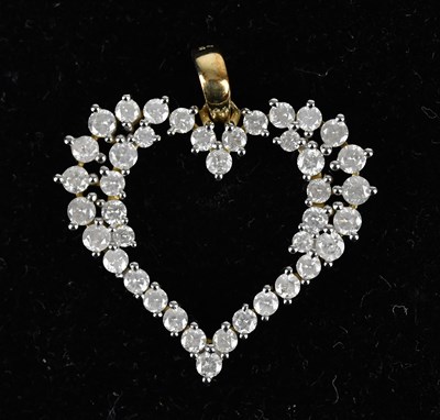 Lot 300 - A 9ct yellow gold diamond heart shaped pendant,...