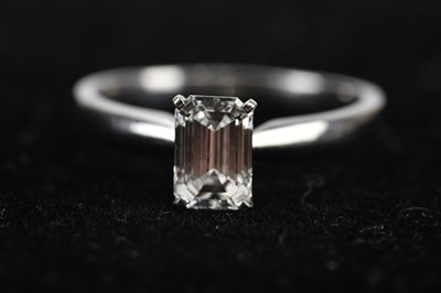 Lot 367 - A platinum diamond emerald cut solitaire dress...