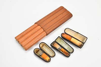 Lot 2111 - A four section leather cigar case, with two...