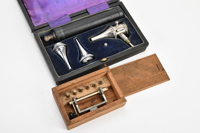 Lot 2201 - A cased otoscope, with a cased clamp (2).