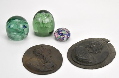 Lot 2077 - Two cast iron wall plaques, with three glass...