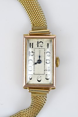 Lot 1189 - An Art Deco yellow metal cased tank style...
