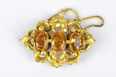 Lot 142 - A Victorian yellow metal pendant brooch set...