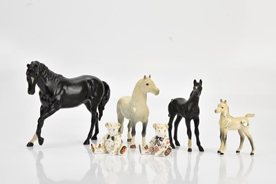Lot 1470 - BESWICK; two horse and foal pairs, black and...