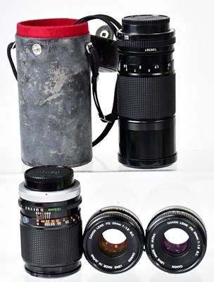 Lot 330 - CANON; four lenses, comprising two FD 50mm 1:1....