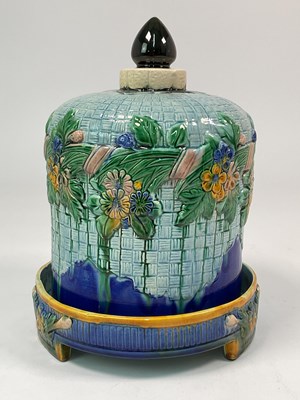 Lot 172 - A Majolica cheese dome with a raised floral...