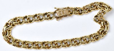 Lot 779 - A 14ct yellow gold double chain link bracelet,...