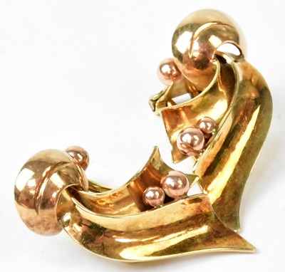 Lot 818 - A pair of yellow metal abstract clip-on...