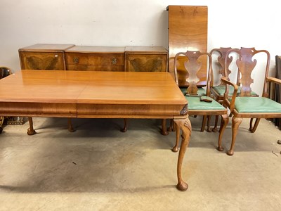 Lot 677 - WARING & GILLOW; a walnut veneered dining room...