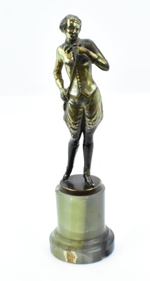 Lot 96 - An Art Deco gilt metal figure of a lady with...
