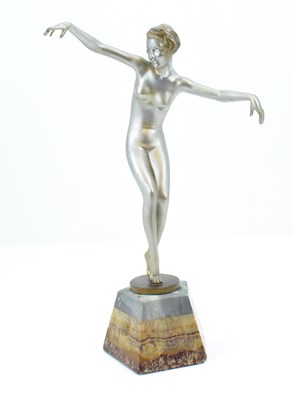 Lot 99 - A 1930s Art Deco figure of a naked dancer with...